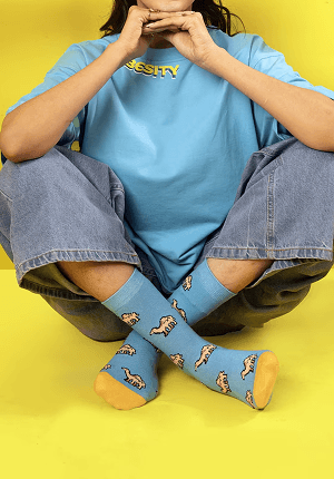 Seated model in blue outfit
